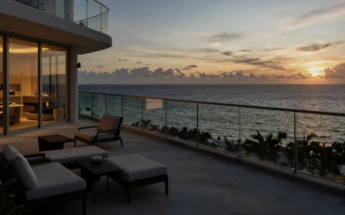 Balcony overlooking the ocean at sunset